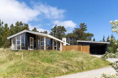 a house on top of a grassy hill at 638-Thisted-Lyngvej-6 in Thisted