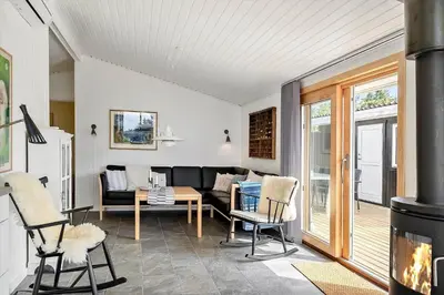 a living room with a couch and a fireplace at 638-Thisted-Lyngvej-6 in Thisted