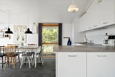 a kitchen with a table and chairs and a dining room at 638-Thisted-Lyngvej-6 in Thisted