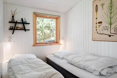 a bedroom with two beds and a window at 638-Thisted-Lyngvej-6 in Thisted