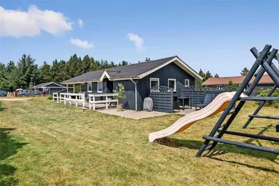 a playground in front of a house with a slide at 770-Thisted-Nordsovej-180 in Thisted
