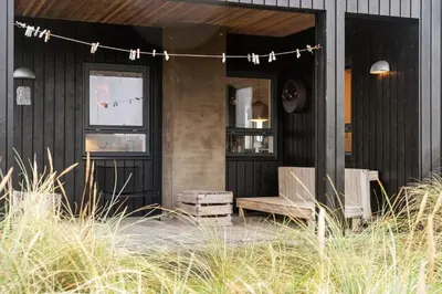 a house with a bench and a string of lights at 904-Thisted-P-Bolesens-Vej-15 in Torsted