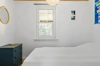 a white bedroom with a bed and a window at 535-Thisted-Molgaardsvej-75 in Thisted