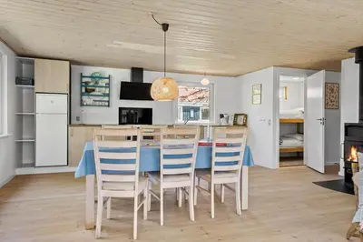 a kitchen and dining room with a table and chairs at 535-Thisted-Molgaardsvej-75 in Thisted