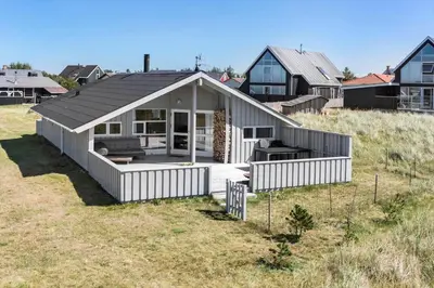 a house with a roof on top of a field at 166-Thisted-Nordsovej-98 in Thisted