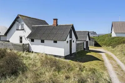 a white house on the side of a hill at 827-Thisted-Orredvej-11 in Thisted