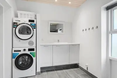 a white laundry room with a washer and a sink at 827-Thisted-Orredvej-11 in Thisted