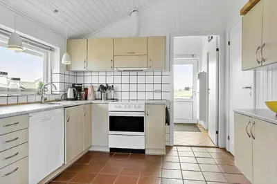 a kitchen with white appliances and white cabinets at 760-Thisted-Pighvarvej-30 in Thisted