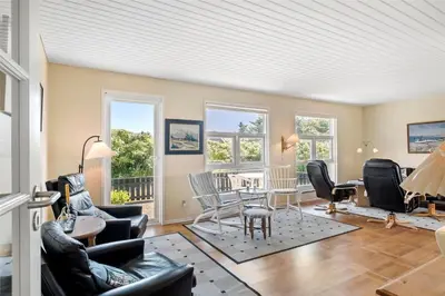 a living room with chairs and a table and windows at 659-Thisted-Orredvej-7 in Thisted