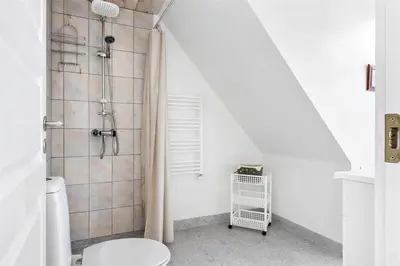 a bathroom with a shower with a toilet in it at 222-Thisted-Nordsovej-57 in Thisted