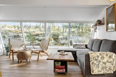 a living room with a couch and a table at 1315-Thisted-Sandtornvej-15 in Thisted