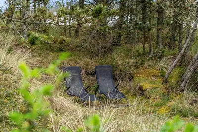 an empty chair sitting in the middle of a field at 1315-Thisted-Sandtornvej-15 in Thisted