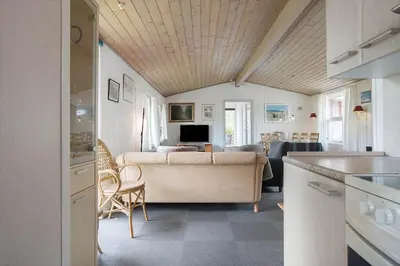a living room with a couch and a table at 619-Thisted-Blabaervej-32 in Thisted