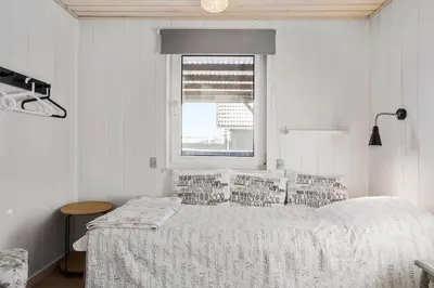 a white bedroom with a bed and a window at 271-Thisted-Nordsovej-88 in Thisted