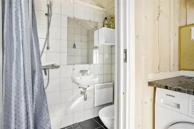 a small bathroom with a sink and a toilet at 938-Thisted-Niels-Vognmands-Vej-8 in Torsted