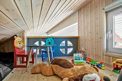 a room with a table and teddy bears on the floor at 854-Thisted-Molgaardsvej-3 in Thisted