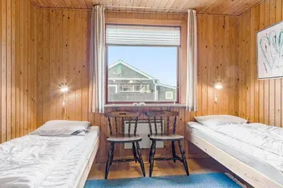 a room with two beds and a window and two stools at 882-Thisted-Nordsovej-100 in Thisted