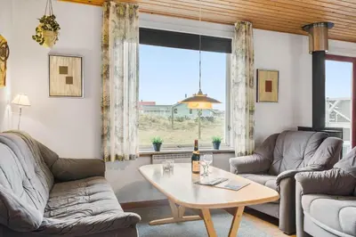 a living room with two couches and a table at 882-Thisted-Nordsovej-100 in Thisted