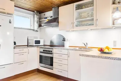 a white kitchen with white cabinets and a sink at 882-Thisted-Nordsovej-100 in Thisted