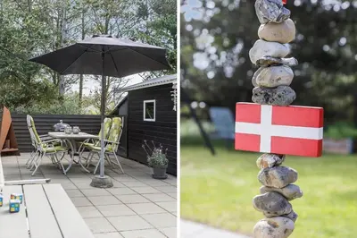 a stack of rocks sitting next to a table with an umbrella at 834-Thisted-Revlingvej-9 in Thisted
