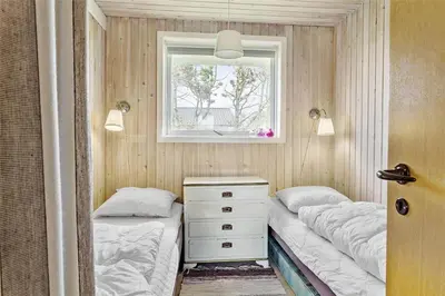 a bedroom with two beds and a window at 215-Thisted-Tunvej-29 in Thisted