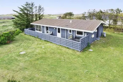 a small blue house on a grass field at 215-Thisted-Tunvej-29 in Thisted
