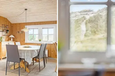 a kitchen and a dining room with a table and chairs at 861-Thisted-Havbovej-41 in Thisted