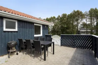 a black table and chairs on a patio at 599-Thisted-Fiskervej-165 in Thisted