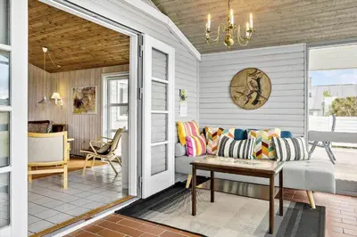 a living room with a couch and a table at 928-Thisted-Kobbelsti-15 in Torsted