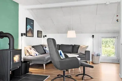 a living room with a couch and a chair at 572-Thisted-Kristinesvej-7 in Thisted