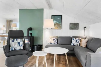 a living room with a couch and a table and a chair at 572-Thisted-Kristinesvej-7 in Thisted