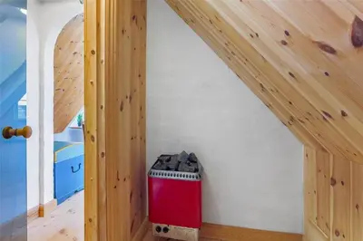 a room with a wooden staircase with a red trash can at 125-Thisted-Fiskervej-7 in Thisted