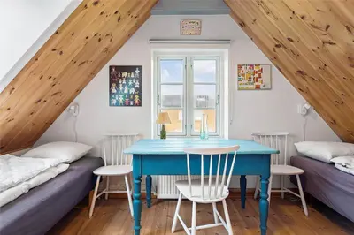 a room with a blue table and two beds at 125-Thisted-Fiskervej-7 in Thisted