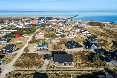 an aerial view of a residential neighborhood with the ocean at 744-Thisted-Orredvej-26 in Thisted