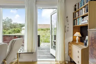 a room with a large glass door leading to a balcony at 240-Thisted-Hummervej-10 in Thisted