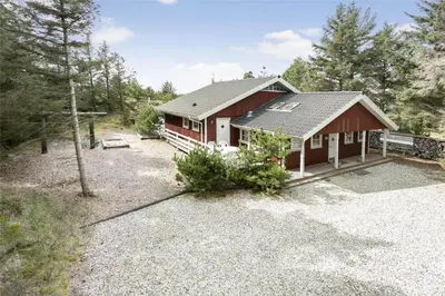 a small red house with a gravel yard at 929-Thisted-Brandisvej-19 in Torsted