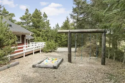 a playground in front of a house with a swing at 929-Thisted-Brandisvej-19 in Torsted