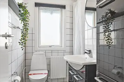 a bathroom with a white toilet and a sink at 670-Thisted-Krebsvej-4 in Thisted