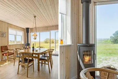 a kitchen and dining room with a wood stove at 1051-Thisted-Skjaerbakken-57 in Torsted