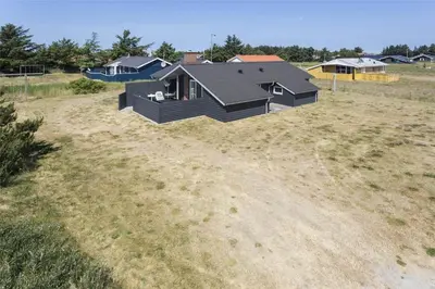 a house sitting on top of a field at 533-Thisted-Fiskervej-153 in Thisted