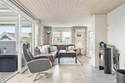 a living room with a couch and a fireplace at 581-Thisted-Nordsovej-32 in Thisted