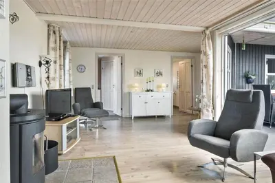a living room with two chairs and a television at 581-Thisted-Nordsovej-32 in Thisted