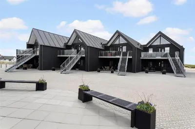 a large black building with stairs and a bench at 785-Thisted-Havstokken-32-A in Thisted