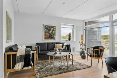 a living room with a couch and a table at 785-Thisted-Havstokken-32-A in Thisted