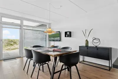 a dining room with a table and some chairs at 785-Thisted-Havstokken-32-A in Thisted