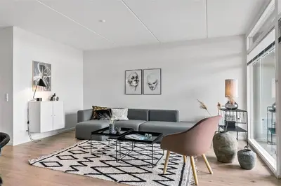 a living room with a couch and a table at 784-Thisted-Havstokken-30-A in Thisted