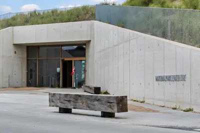 a concrete building with a bench in front of it at 784-Thisted-Havstokken-30-A in Thisted