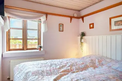 a bedroom with a bed and a window at 787-Thisted-Nordsovej-38 in Thisted
