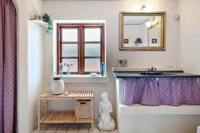 a bathroom with a sink and a mirror and a window at 787-Thisted-Nordsovej-38 in Thisted