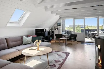 a living room with a couch and a table at 580-Thisted-Gaeslingevej-5 in Thisted